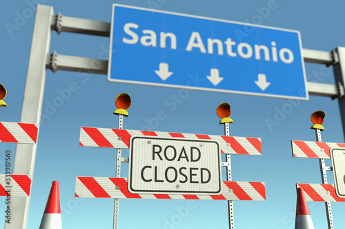 Barriers near San Antonio city traffic sign. Coronavirus disease quarantine or lockdown in the United States conceptual 3D rendering © Alexey Novikov