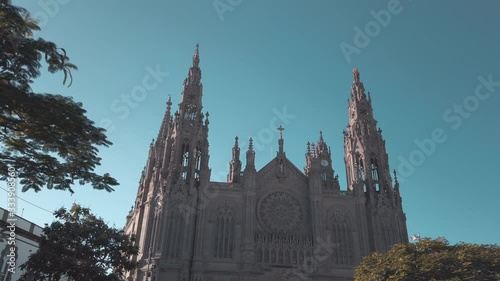 Scenic cinematic slow motion video of Church of San Juan Bautista (Parroquia Matriz de San Juan Bautista) in Arucas in Gran Canaria island in Canary islands in Spain. Beautiful look of catholic church