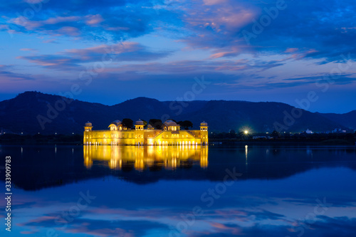 Rajasthan famous tourist landmark - Jal Mahal Water Palace on Man Sagar Lake in the evening in twilight. Jaipur, Rajasthan, India