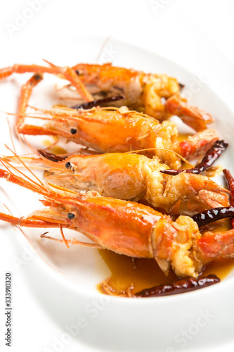 fired giant freshwater prawn with tamarine sauce on with plate closeup shot