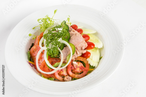 tuna salad in a white plate lots of vegetable and healthy food