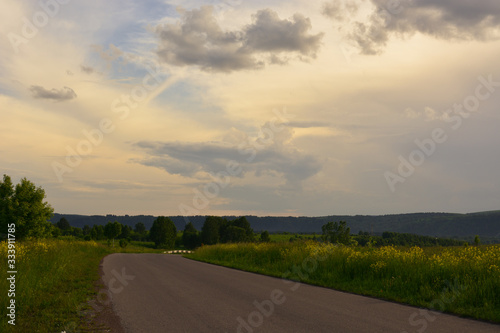 Road outside the city at sunset © Natalia
