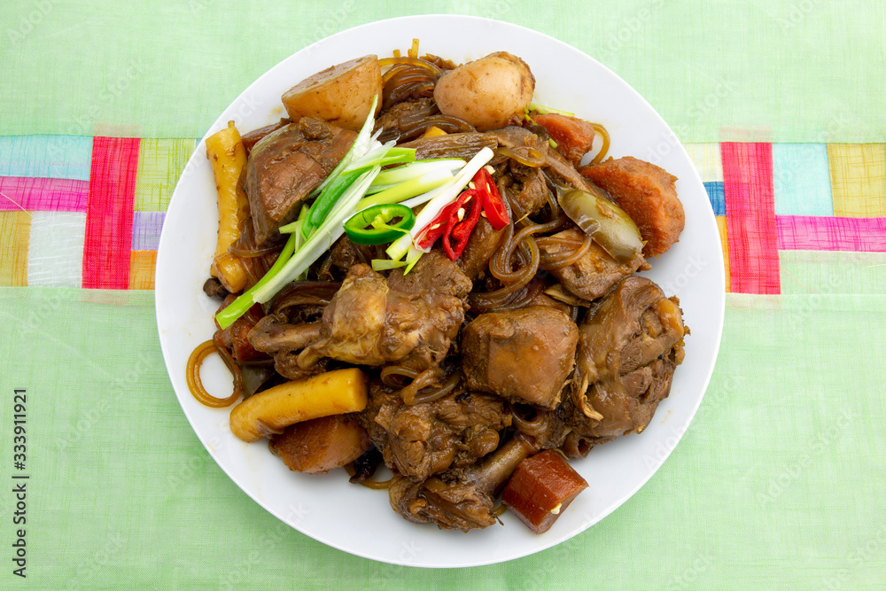 Korean chicken stew with soy sauce, glass noodle, rice cake and vegetables Korean chicken stew with soy sauce, glass noodle, rice cake and vegetables
