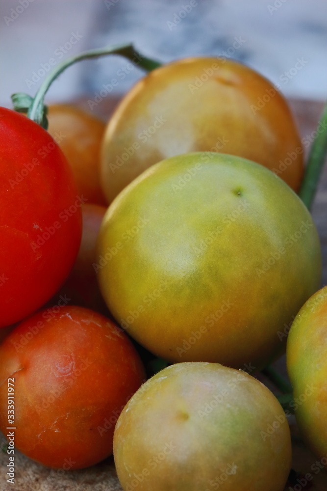 small fresh cherry tomatoes with green vines small fresh cherry tomatoes with green vines