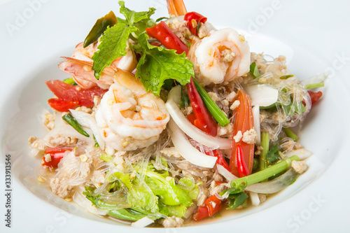 delicious spicy mixed seafood thai food made from shrimps squids minced pork kale chili and vegetable serve in white dish close up