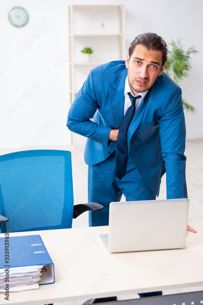 Fototapeta premium Young male employee in work accident concept