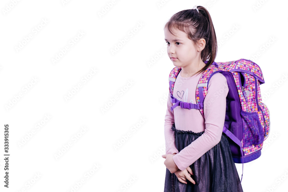 schoolgirl with a school bag turned sideways schoolgirl with a school bag turned sideways