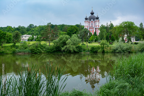 Beautiful view of Curchi Monastery and lake with reflections, Moldova photo