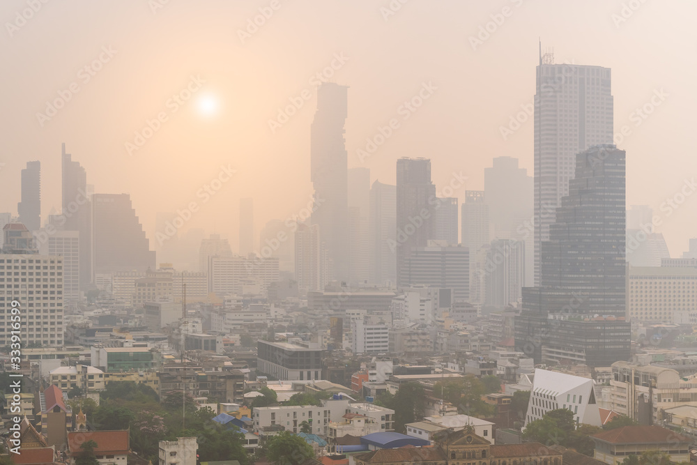 Unhealthy air pollution in Bangkok city business district, pollute with PM 2.5 dust, smog or haze, low visibility