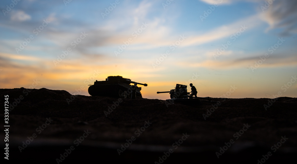 Fototapeta premium War Concept. Military silhouettes fighting scene on war fog sky background, World War Soldiers Silhouette Below Cloudy Skyline At sunset.