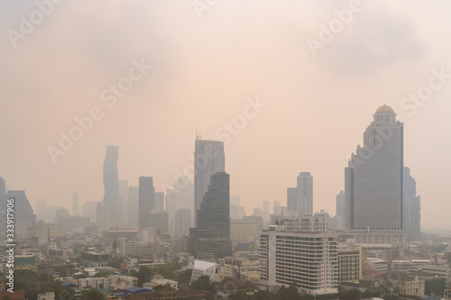 Unhealthy air pollution in Bangkok city business district  pollute with PM 2.5 dust  smog or haze  low visibility