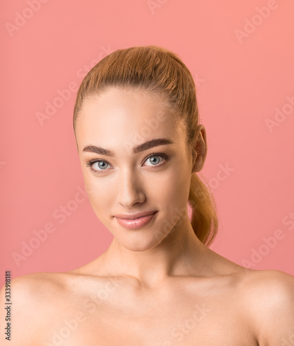 Beautiful Blonde Girl Smiling Looking At Camera, Studio Shot, Vertical