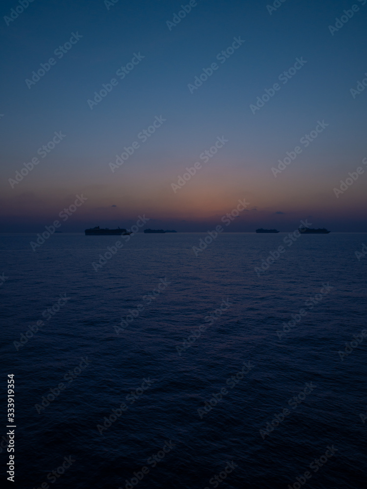 Cruise ships in the open ocean at the quarantine time during COVID-19 virus epidemic Cruise ships in the open ocean at the quarantine time during COVID-19 virus epidemic