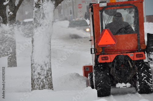 Snow Plowing Sidewalk in Winter