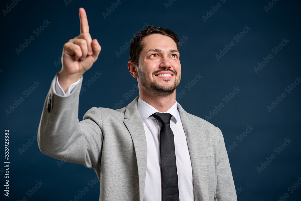 Portrait of business young handsome male making good idea gesture