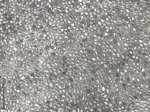 Texture of a stone road. Old paved road background texture. Part of a stone street, for background or texture
