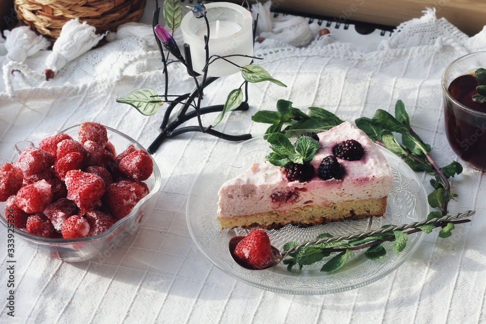 Fresh delicious dessert with berries and green decoration, sweet food, tea time