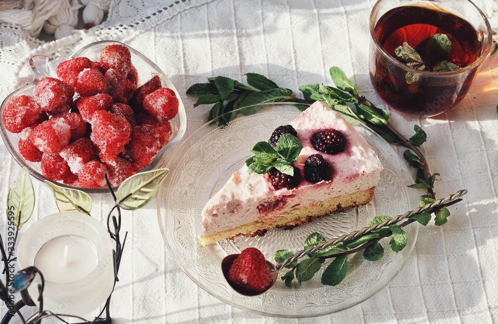 Fresh delicious dessert with berries and green decoration, sweet food, tea time, top view