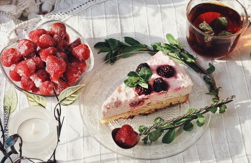 Obraz na płótnie Fresh delicious dessert with berries and green decoration, sweet food, tea time, top view w salonie