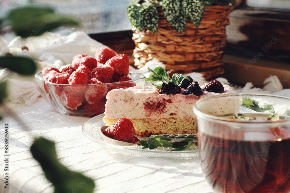 Fresh delicious dessert with berries and green decoration, sweet food, tea time