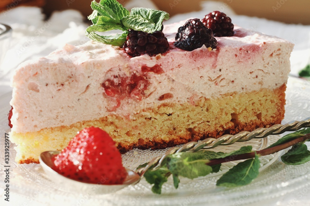 Fresh delicious dessert with berries and green decoration, sweet food, tea time, detailed close up
