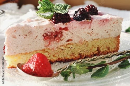 Obraz na płótnie Fresh delicious dessert with berries and green decoration, sweet food, tea time, detailed close up w salonie