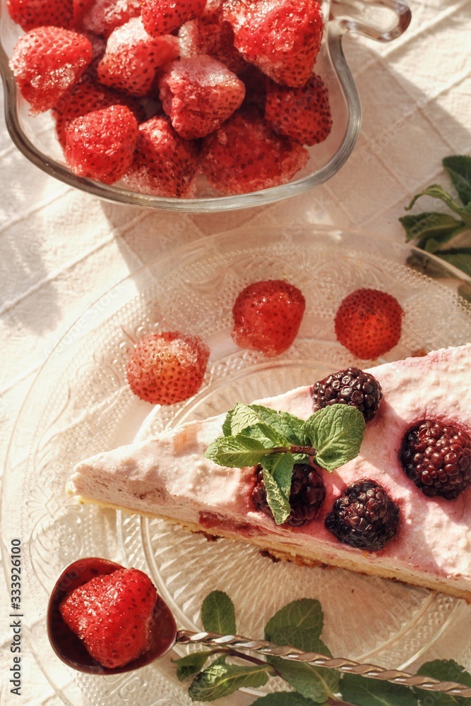 Fresh delicious dessert with berries and green decoration, sweet food, tea time, top view