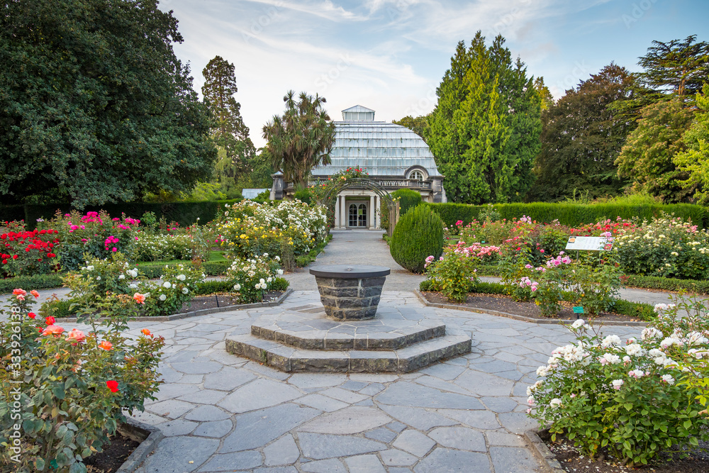 Christchurch, New Zealand - Feb 11, 2020: The beautiful rose garden with Cuningham, Townend and Garrick House at Botanic Gardens Conservatory.