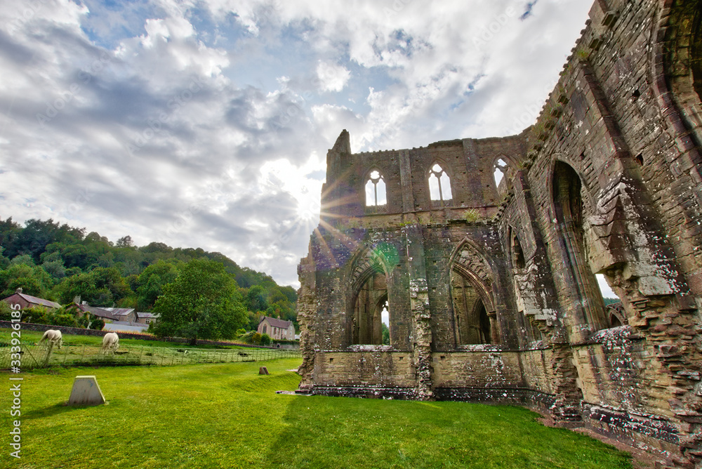 The ruins of Tintern Abbey, founded by Walter de Clare, Lord of Chepstow, on 9 May 1131. It is situated adjacent to the village of Tintern in Monmouthshire, Wales, UK. The ruins of Tintern Abbey, founded by Walter de Clare, Lord of Chepstow, on 9 May 1131. It is situated adjacent to the village of Tintern in Monmouthshire, Wales, UK.