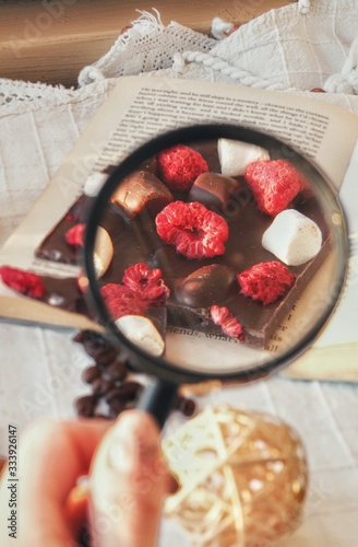 Obraz na płótnie Crafted handmade chocolate bar with marshmallow and berries, coffee beans and good book w salonie