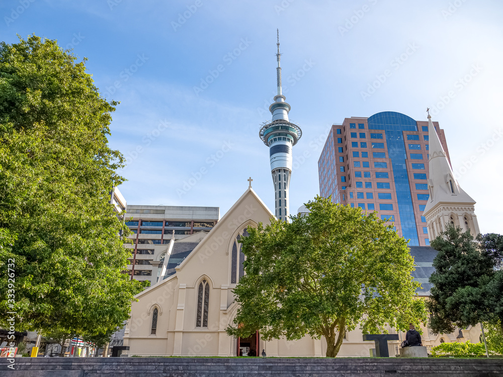 Naklejka premium Sky Tower with St Patrick's Cathedral in Auckland city of New Zealand.