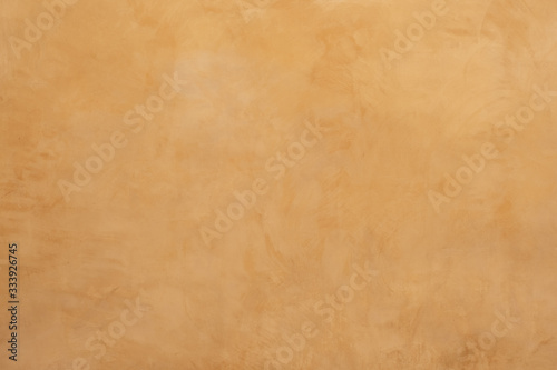 The surface of the wall with the old paint. The background of weathered painted wall. Texture of old plaster wall. 