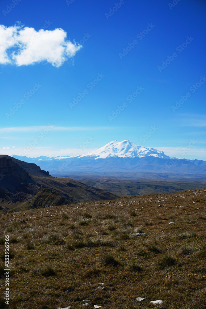 Elbrus volcano in summer from the Bermamyt plateau Russia Elbrus volcano in summer from the Bermamyt plateau Russia