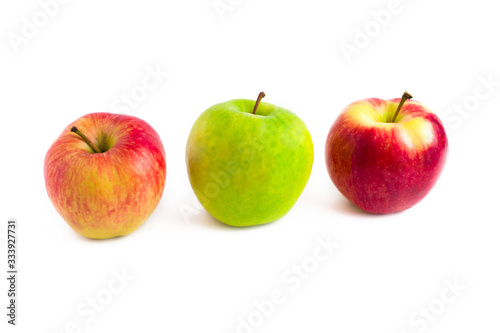 The apples on a white background. A group of apples green and red on a white background photo