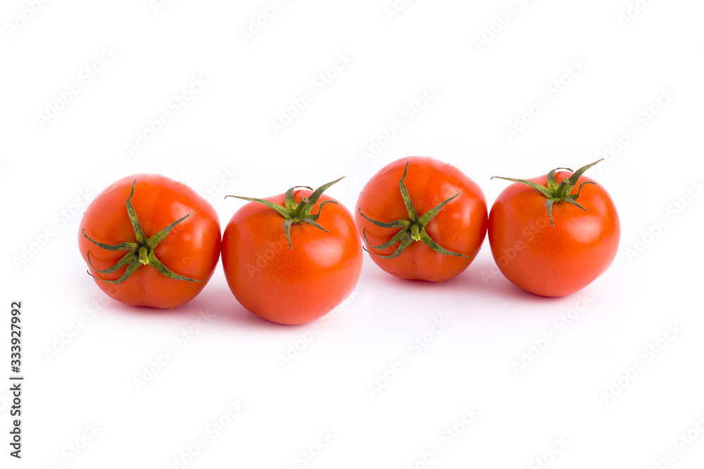 Fresh tomatoes isolated on white background. Four red ripe tomatoes isolated on white background. Tomatoes on white background.