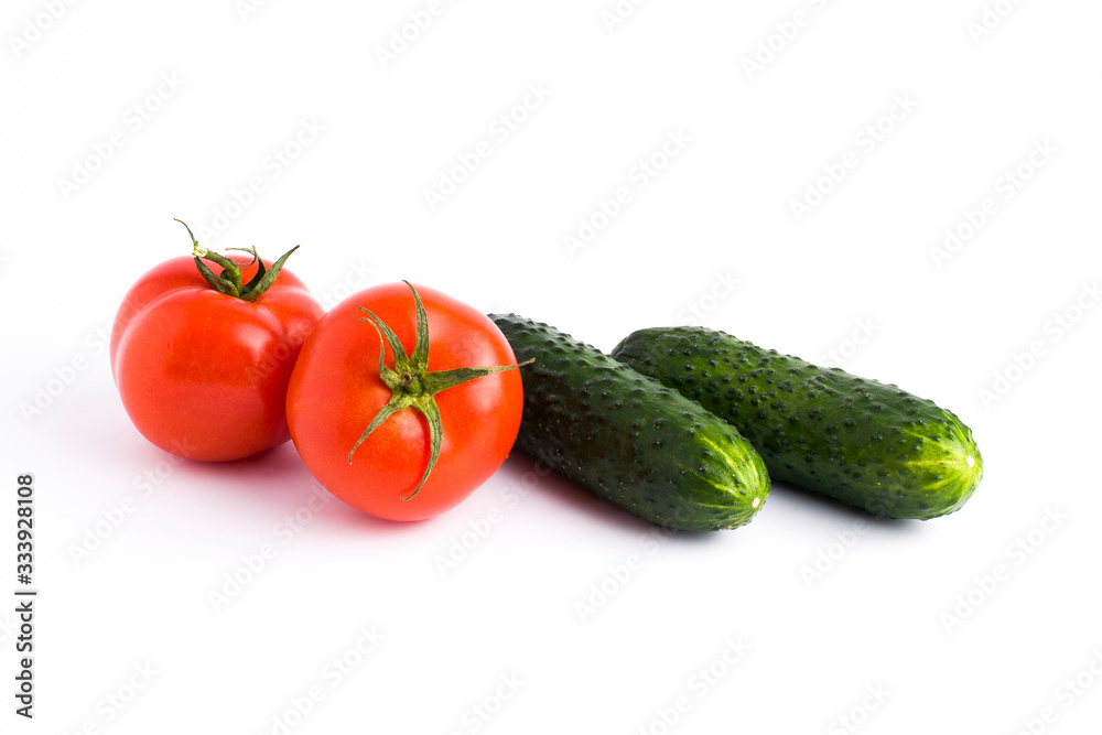 Red tomato garlic and cucumber on a white background.Fresh vegetables on a white background. cucumber and tomato on a white background