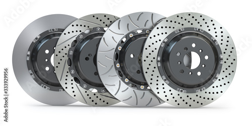 Different types of brake disks. Drilled and slotted brake disks in a row.