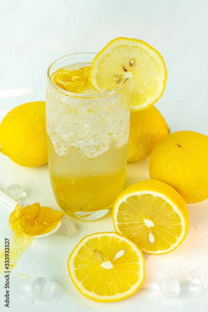 Fresh lemon soda drink iced with lemon sliced on white background. Fresh lemon soda drink iced with lemon sliced on white background.