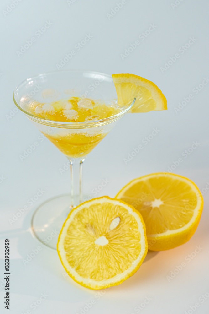 Fresh lemon soda drink iced with lemon sliced on white background.
