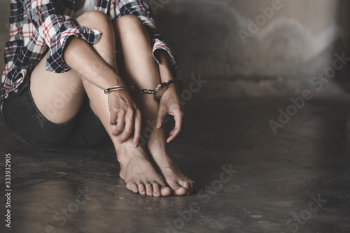 The slave girl was handcuffed and kept. Women violence and abused concept,  human trafficking Concept, international women's day.