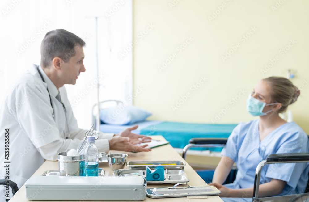 Medicine and Healthcare concept. Senior doctor consults or discussing something with young patient woman while sitting at the clinic or hospital. Doctor and patient Medicine and Healthcare concept. Senior doctor consults or discussing something with young patient woman while sitting at the clinic or hospital. Doctor and patient