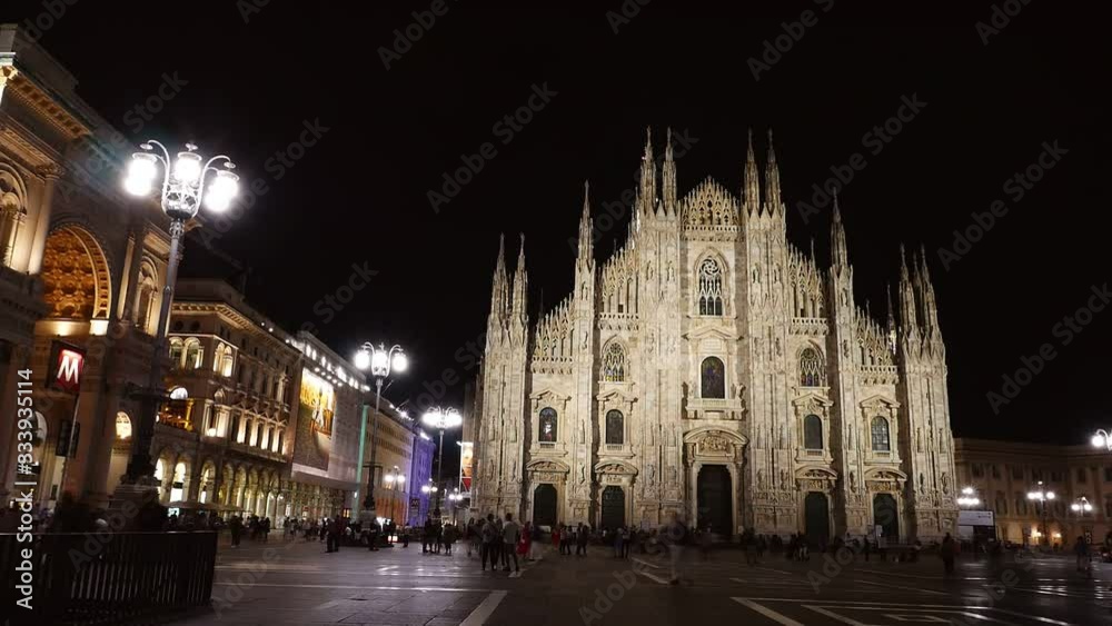 Night time-lapse of People at Duomo di Milano or Milan Cathedral in the city of Milan Night time-lapse of People at Duomo di Milano or Milan Cathedral in the city of Milan