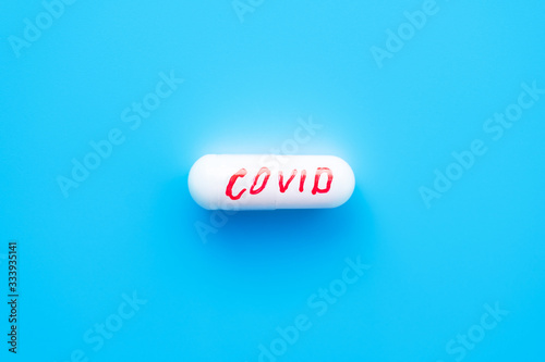 pill with the inscription "covid-19". medicine for coronavirus, concept.