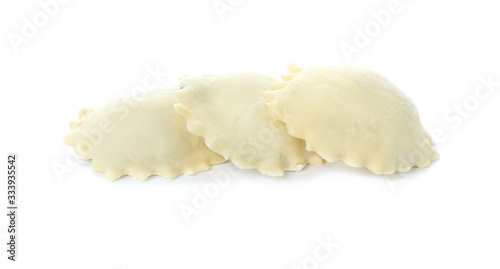 Raw ravioli on white background