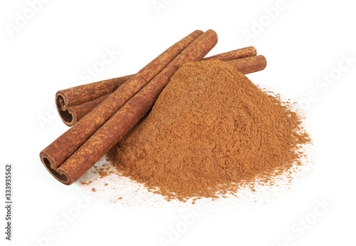 Cinnamon stick and powder isolated on white background.