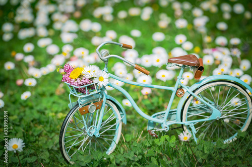 Canvas Print bicycle model set in flowery meadow
