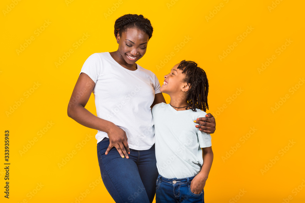 Black mother posing with her happy kid Black mother posing with her happy kid