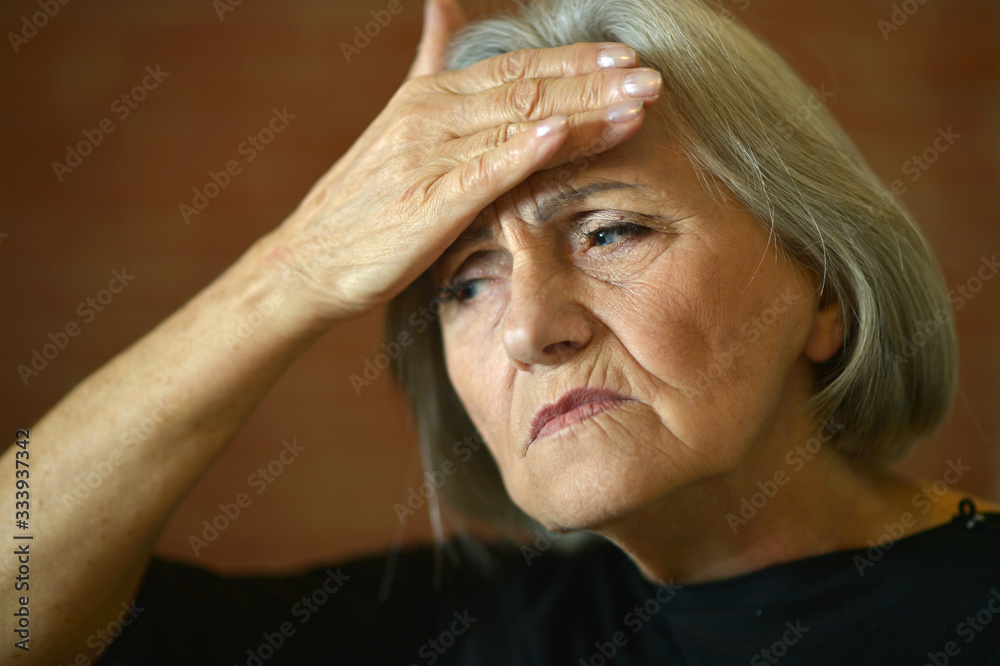 Portrait of beautiful senior woman with headache Portrait of beautiful senior woman with headache
