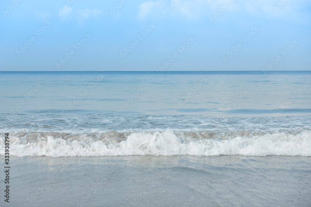 Beautiful beach, turquoise ocean water and blue sky with clouds in sunny day. Background for summer vacation. Beautiful beach, turquoise ocean water and blue sky with clouds in sunny day. Background for summer vacation.
