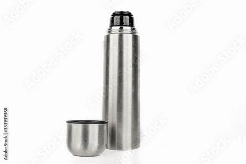 Silver thermos isolated on a white background.